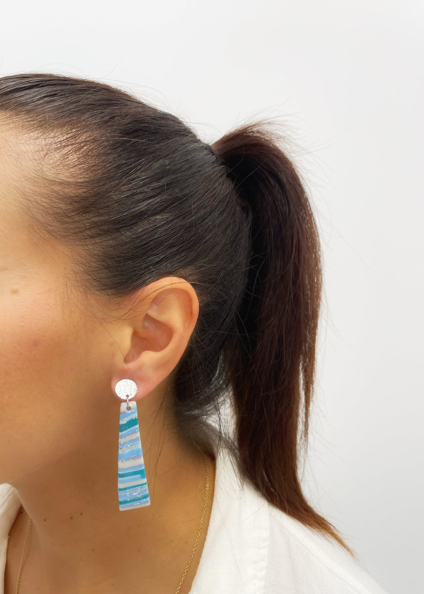 Turquoise earrings with gold veins and sparkles