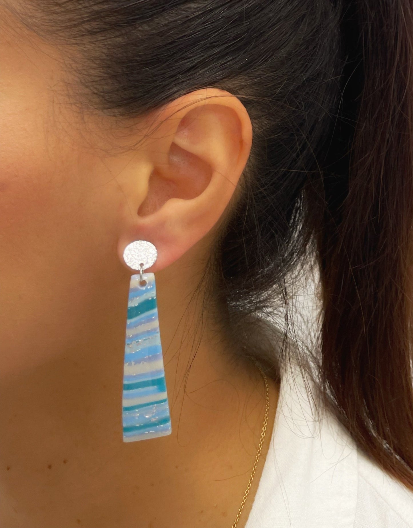 Turquoise earrings with gold veins and sparkles